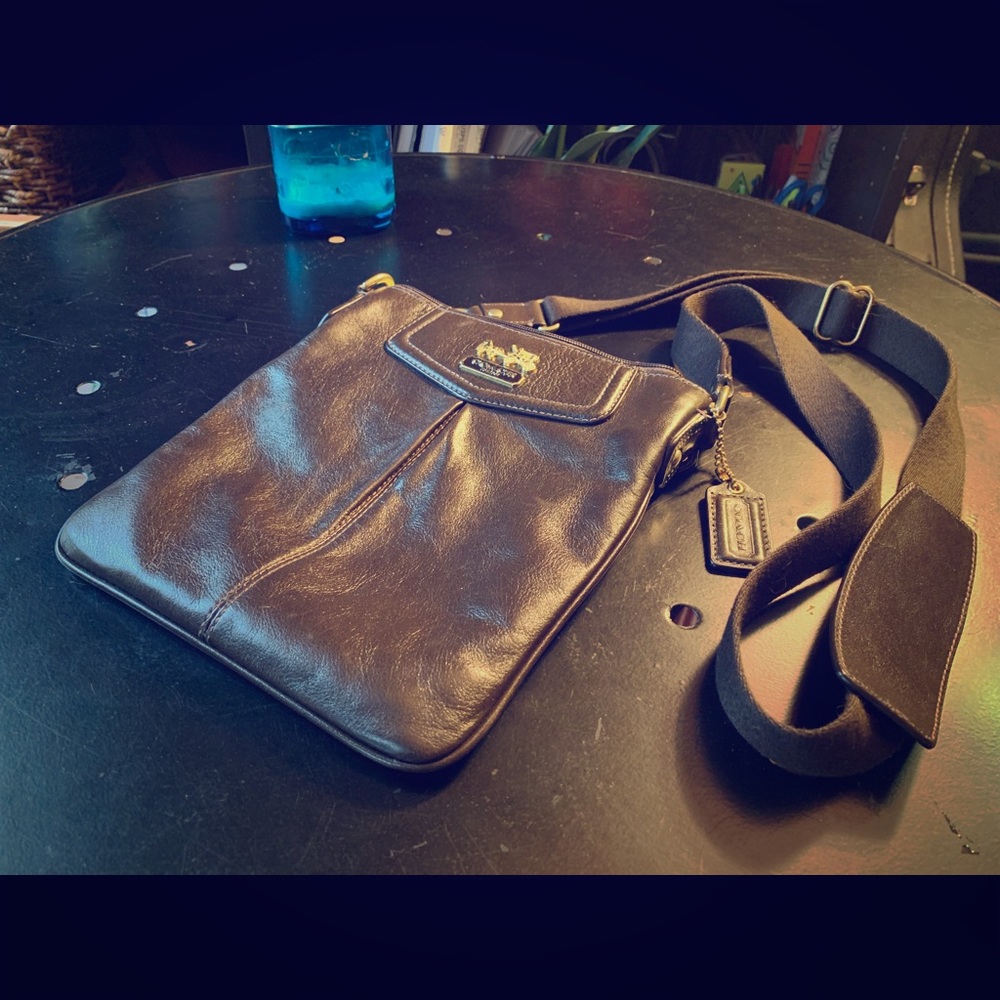 Leather Coach crossbody bag with teal interior